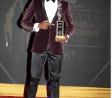 Hansle Parchment- holding - trophy- RJRGLEANER Sportsman of the year 2021