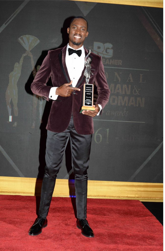 Hansle Parchment- holding - trophy- RJRGLEANER Sportsman of the year 2021